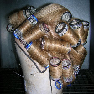 Where makeup artists work - setting wigs for theatre